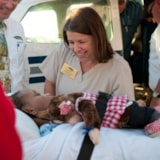 Medical team aids patient at aircraft after Oklahoma tornado