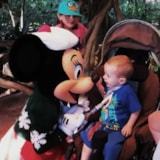 Make-A-Wish child meets Minnie Mouse during a family wish trip