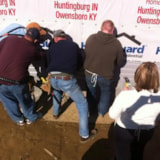 Volunteers install siding on a Habitat home in Owensboro, KY