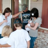 Volunteers pray with a Wellston, OK family after disaster