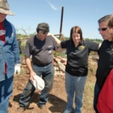 Volunteers pray amid disaster debris in Wellston, Oklahoma
