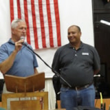 A speaker addresses the mission team during Honduras aid work