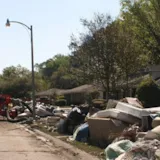Flood debris set out curbside during Monroe, LA home cleanups