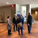 Mission personnel meet in a UN corridor during New York talks