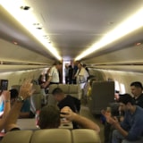 Judah 1 team onboard aircraft for Anchorage children's center