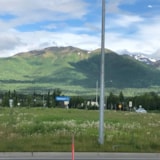 Anchorage mountain backdrop viewed from roadside retail area