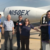 Relief team stages supplies beside aircraft for Bahamas aid