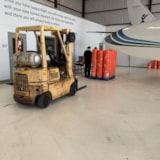 Relief buckets staged beside aircraft for Bahamas response