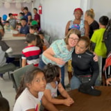 Volunteers gather with families and children in Juárez, Mexico