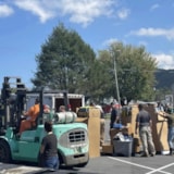 Forklift moves relief supplies as volunteers sort in Florida