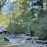 Hurricane Helene leaves a washed-out Florida road by a creek