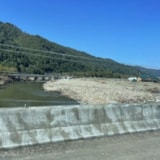 Riverbank scoured and strewn with debris after Hurricane Helene
