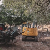 Excavators and loaders clear flood debris in Kerrville, TX