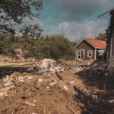 Flood damage and debris around homes in Kerrville, Texas