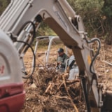 Excavators remove flood debris in Kerrville during recovery