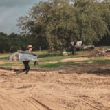 Volunteer clears debris after flooding in Kerrville, Texas
