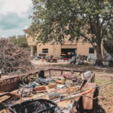 Flood-damaged belongings staged for removal in Kerrville, TX
