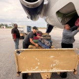 Relief team loads bags onto jet in Bahamas amid Hurricane Melissa
