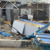 Hurricane Melissa damage litters a Jamaican market area