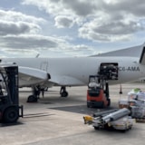 Forklifts load relief cargo onto aircraft bound for Jamaica