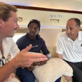 Relief partners confer aboard aircraft after Hurricane Melissa