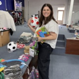 Volunteer sorts toys and supplies in Juárez, Mexico for children