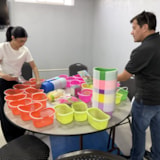 Volunteers assemble supply baskets for families in Juárez