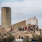 Relief teams search collapsed building after Venezuela quake