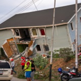 Emergency teams assess damage at collapsed building in Venezuela