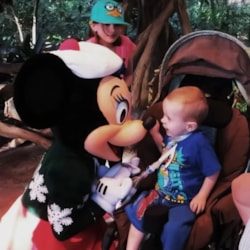 Make-A-Wish child meets Minnie Mouse during a family wish trip