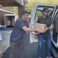 Volunteers unload medical supplies for Judah 1 mission relief