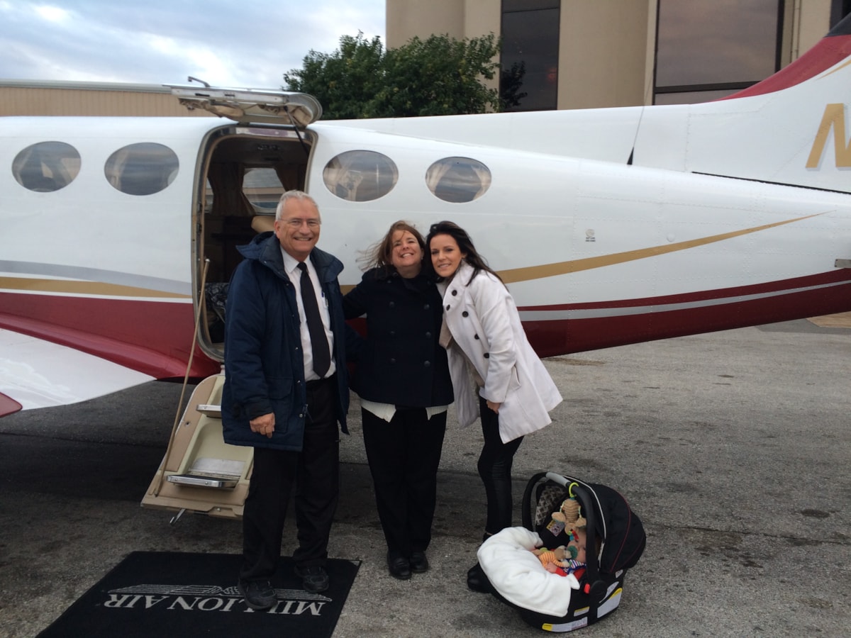 Judah 1 team gather with Taylor Hargis and her baby