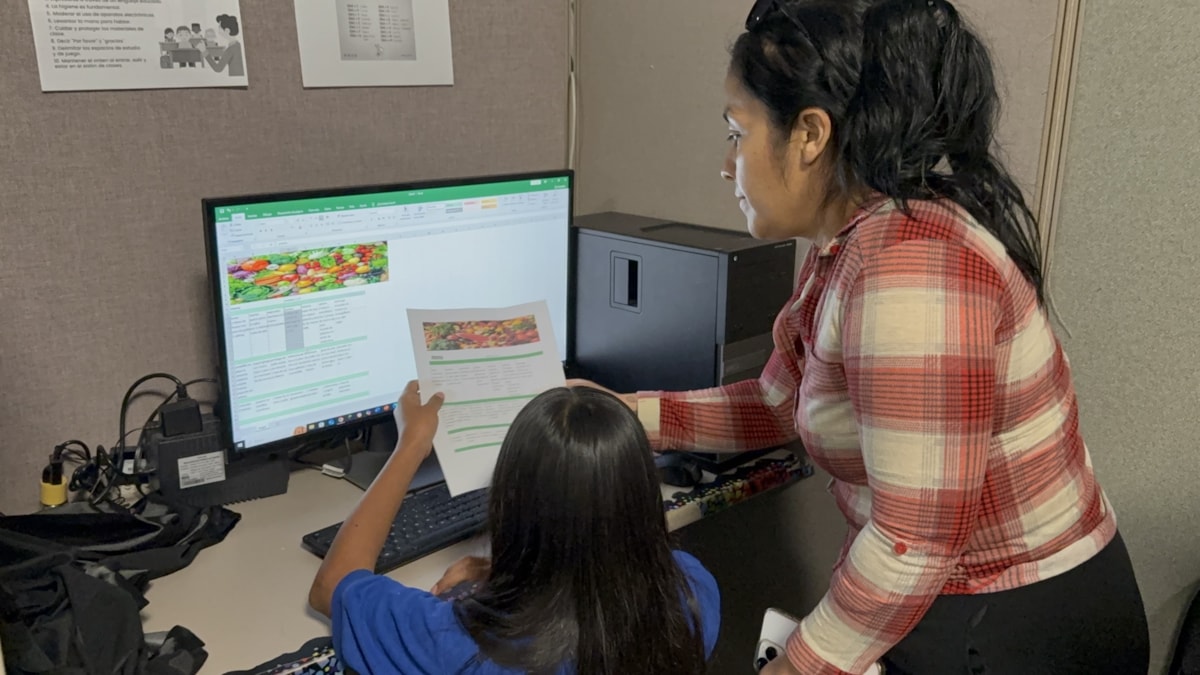 A student gets support during a computer lesson in Juárez