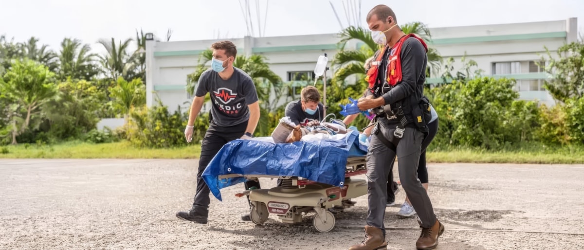 Medic Corps relief team transports a patient for treatment